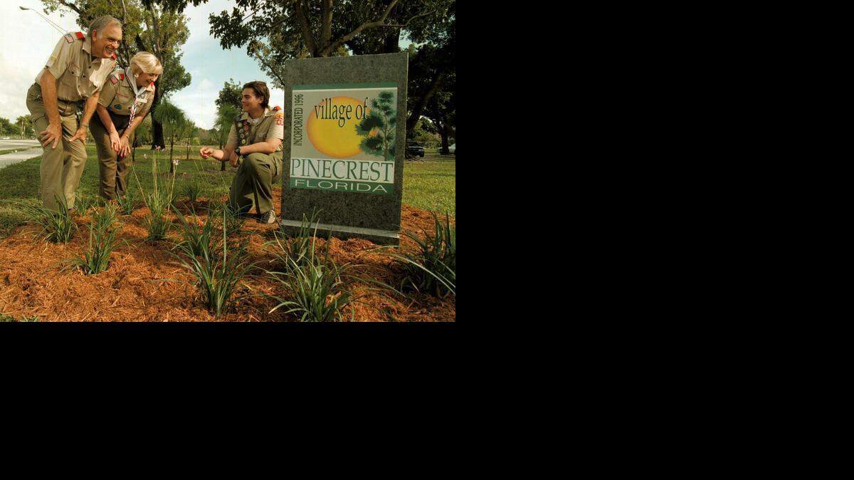 
TROOP LEADER: Dave Ziska served as a Scoutmaster for 36 years and oversaw 289 boys to the rank of Eagle Scout. Here, in 1997, Boy Scout Christopher Azrak shows his Eagle Scout project to landscape the three entrance signs for the Village of Pinecrest to husband-and-wife Scoutmasters Dave and Julie Ziska.
