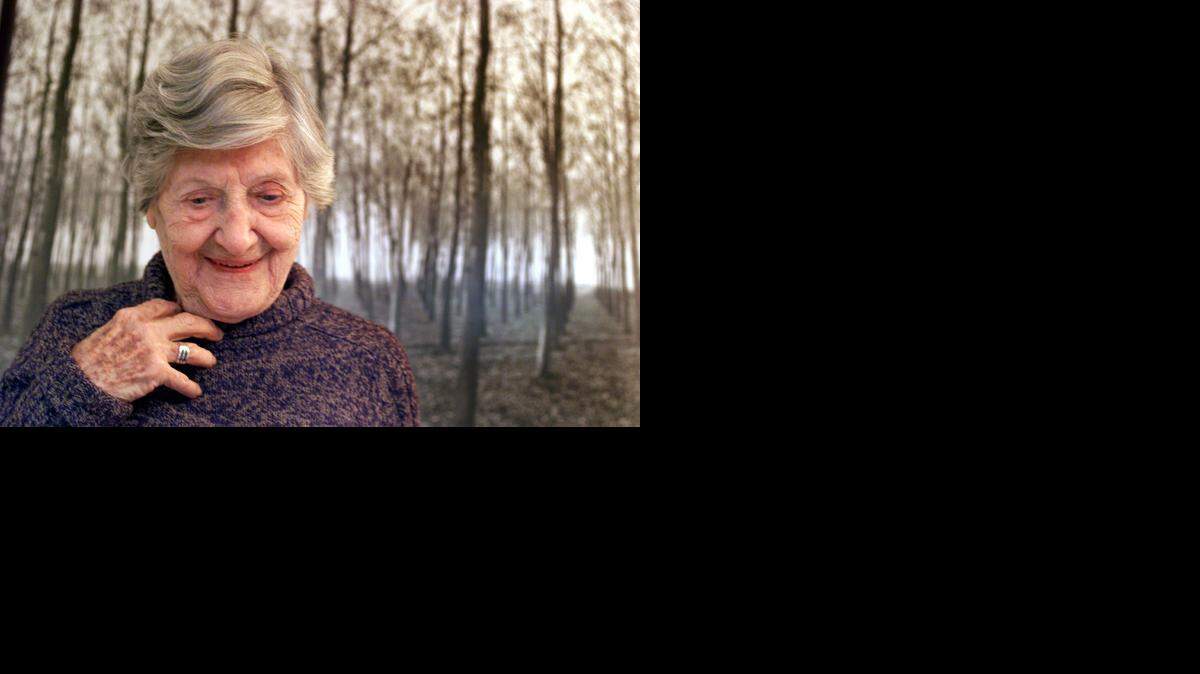 
PHOTOGRAPHER: Klara Farkas at her Coconut Grove home in front of one of her photographs in January 2003. Her daughter Georgette Ballance had put together a show of her mother's photographs at The Kampong that winter.
