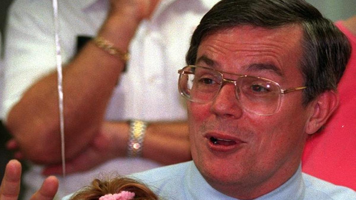 In this Sept. 8, 1994 file photo, Metro-Dade Commissioner Larry Hawkins was at his campaign headquarters during a run-off for county commission seat, District 8. His grandaughter, Samantha Hawkins, then-3, sat on Hawkins’ lap.