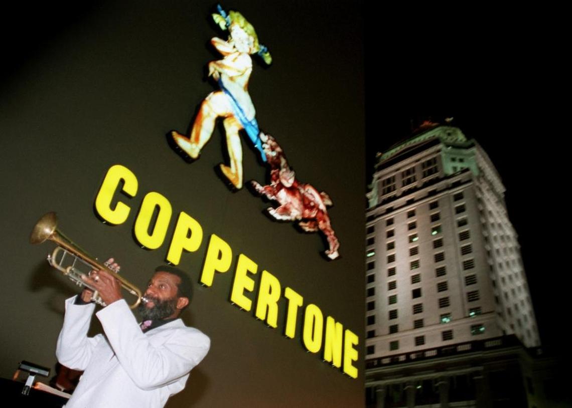 Melton Mustafa belted out a tune just after the lighting of the Coppertone sign on the Concord building on West Flagler in Miami in March 1995. He was part of an outdoor reception to kick off the 150th birthday celebration of the state of Florida.