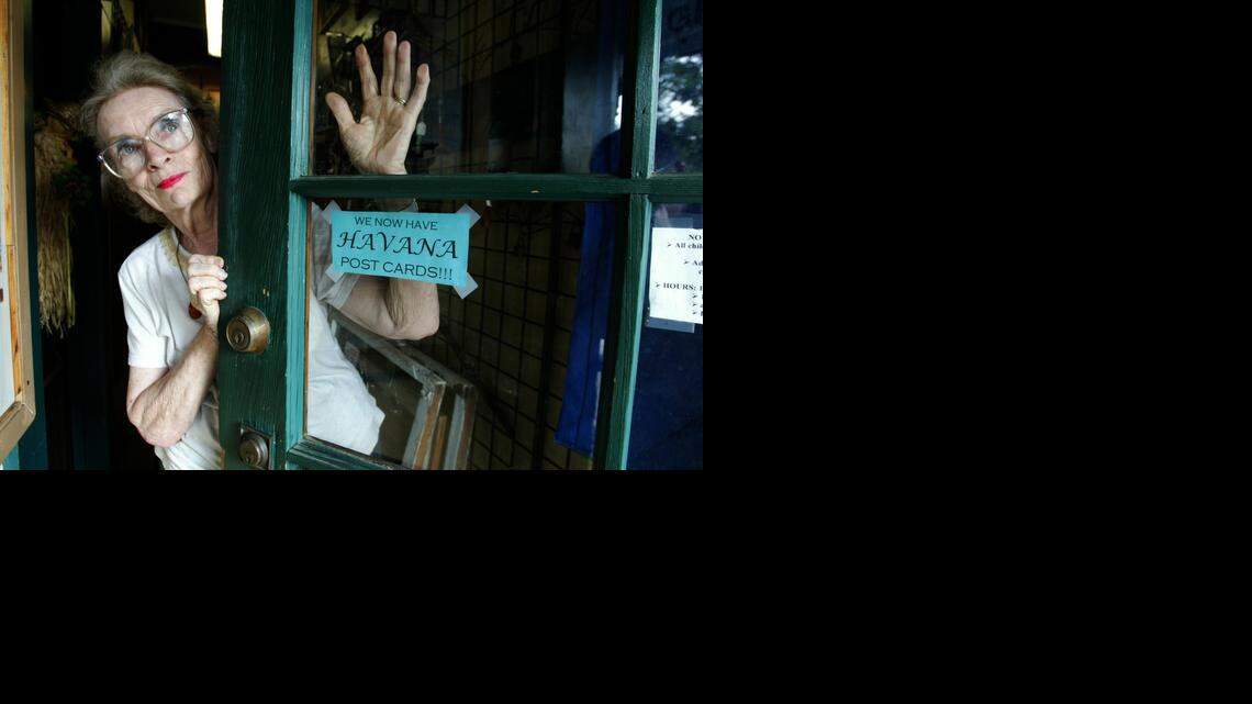 
TRAILBLAZER: Nikki Beare left journalism to commit herself to the feminist movement in the late 1960s. Here, in October 2004, she stands near the door of her antique store in Havana, Fla. Beare moved to the North Florida town after Hurricane Andrew. 
