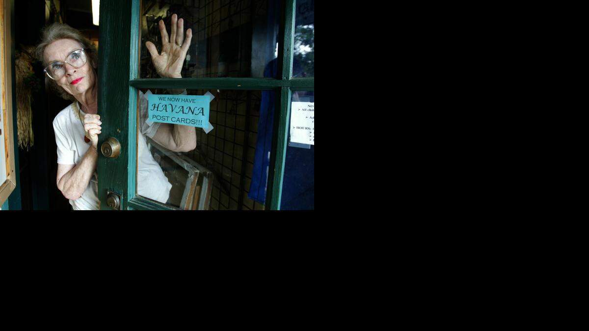 
TRAILBLAZER: Nikki Beare left journalism to commit herself to the feminist movement in the late 1960s. Here, in October 2004, she stands near the door of her antique store in Havana, Fla. Beare moved to the North Florida town after Hurricane Andrew. 

