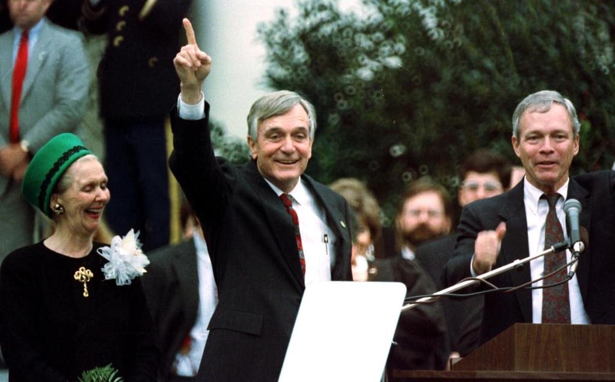 Rhea Chiles, left, her husband, former Florida Gov. Lawton M. Chiles, center, and Lt. Gov. Buddy McKay, right, acknowledge cheers from supporters in this 1991 file photo taken at Chiles’ inauguration in Tallahassee.