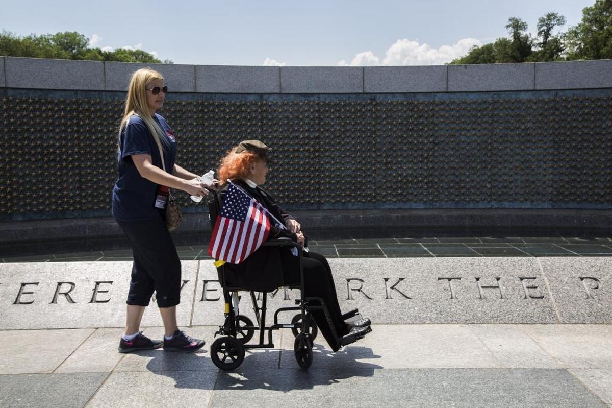Marine Corps veteran Conni Gordon of Miami was assisted through the World War II memorial on May 30, 2015.