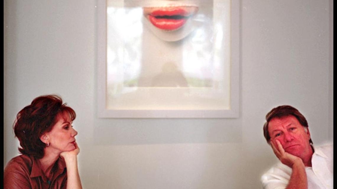 Cricket and Marty Taplin pose for a portrait in the lobby of their fine art-infused Sagamore Hotel on Miami Beach in July 2002. The couple turned the hotel into an Art Basel Miami Beach hot spot.