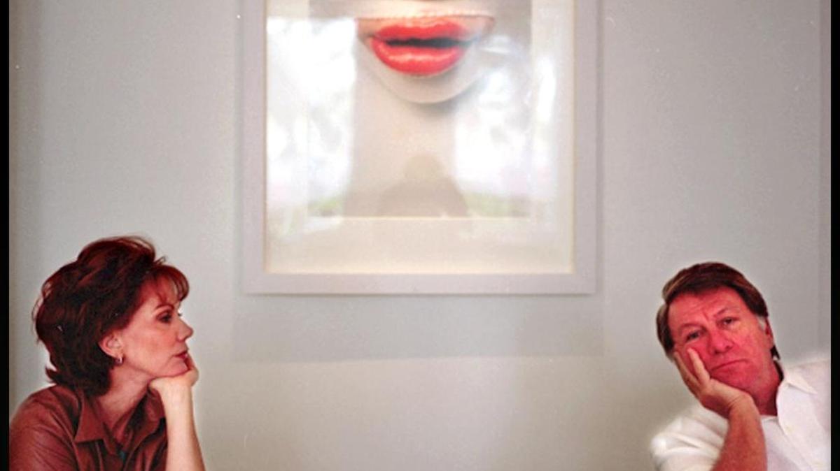 Cricket and Marty Taplin pose for a portrait in the lobby of their fine art-infused Sagamore Hotel on Miami Beach in July 2002. The couple turned the hotel into an Art Basel Miami Beach hot spot.
