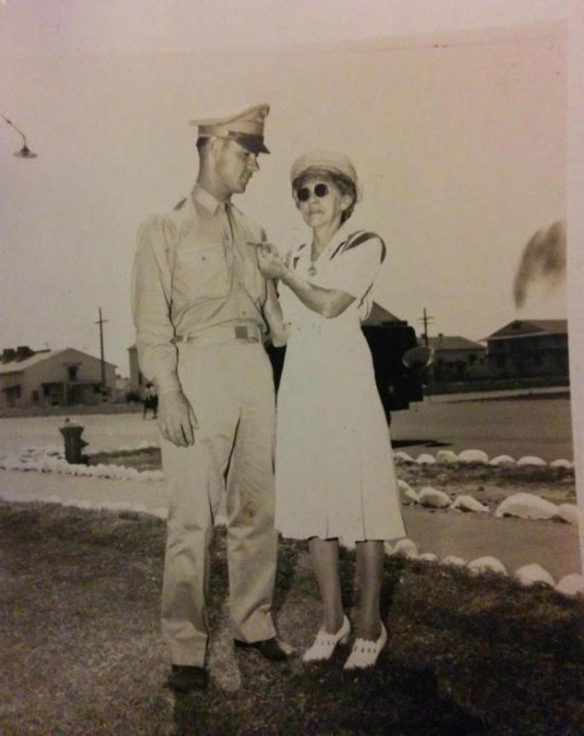 Clyde Roach’s mother Altie Vineyard Roach pinned his pilot wings on his uniform at Luke Field Air Force Base in Arizona in June 1943.