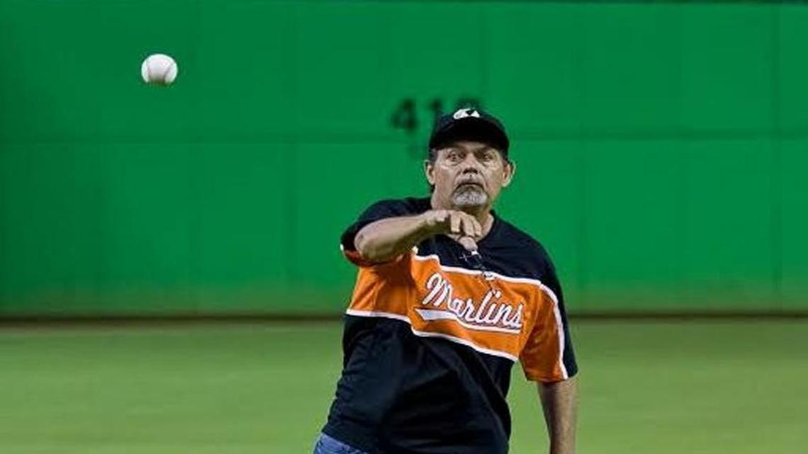 Luis Brande, Coral Way Bilingual K-8 physical education coach and teacher, throws the first pitch at a Marlins game in August 2013.