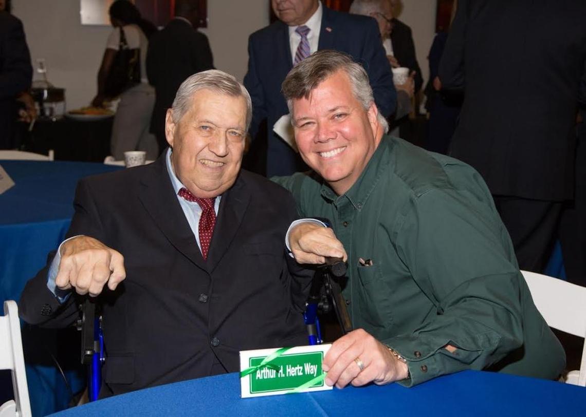 Arthur Hertz, left, celebrates with son Andrew as the Miami Parking Authority named Southwest 16th Street, between 32nd and 37th avenues, Arthur Hertz Way on April 24, 2017.