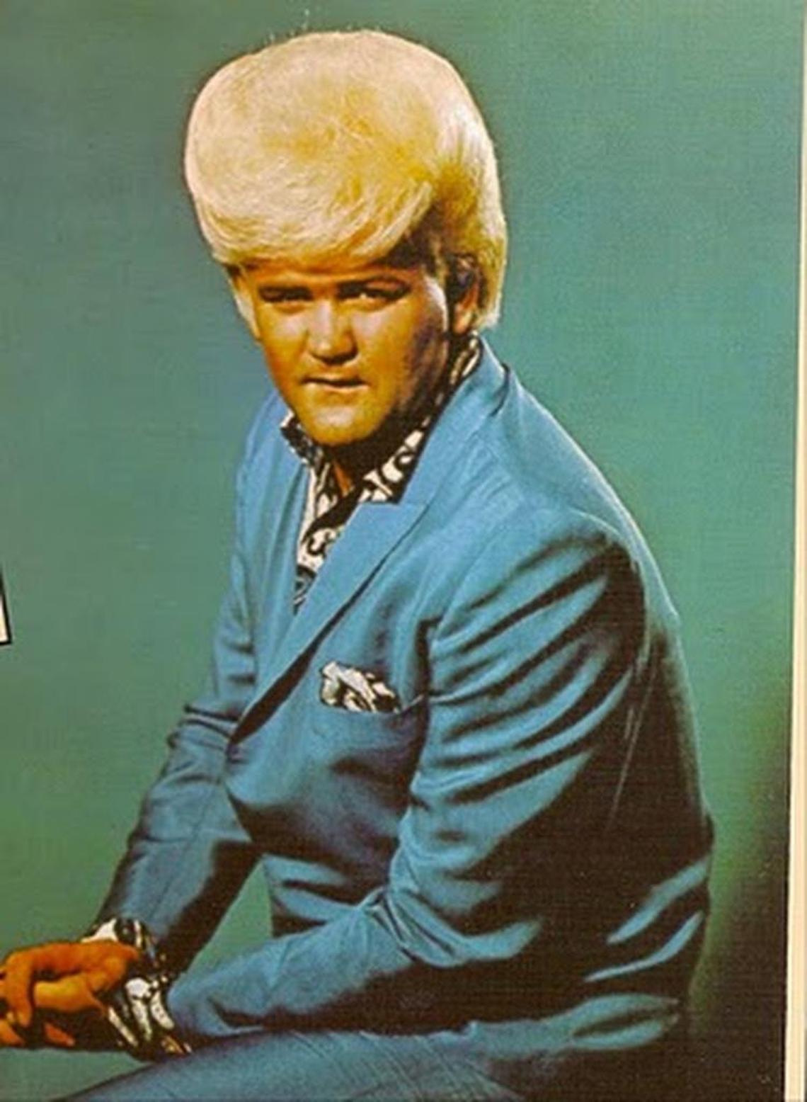 Wayne Cochran’s towering yellow-white pompadour and colorful outfits became as famous as his songs, which included “Goin’ Back to Miami” and “Last Kiss.”