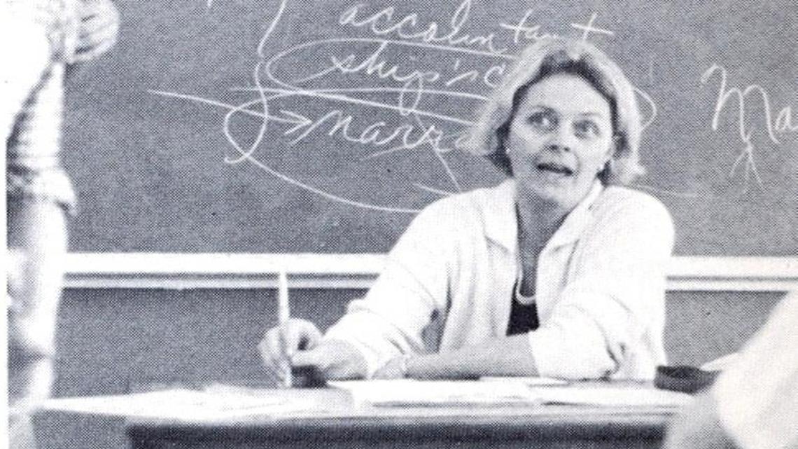 English literature seems scrawled on the chalkboard but that’s likely a remnant from a previous class. Sheila Sawyer, conversing with her students at Christopher Columbus High School in West Miami-Dade in this late 1970s yearbook photo, taught math at the private school from 1976 to 1990.