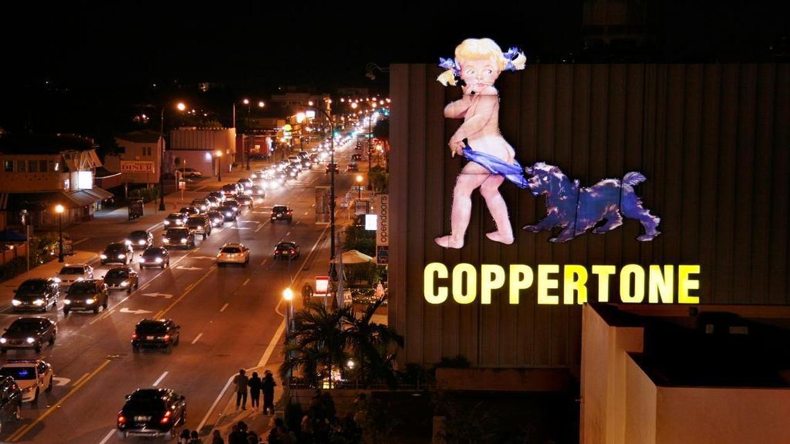 The Coppertone Girl sign shines once more on the streets of Miami in this December 2008 photo after its move to Biscayne Boulevard and Northeast 73rd Street in the new MiMo/Biscayne Boulevard Historic District. Coppertone parent Schering-Plough paid for the renovation.