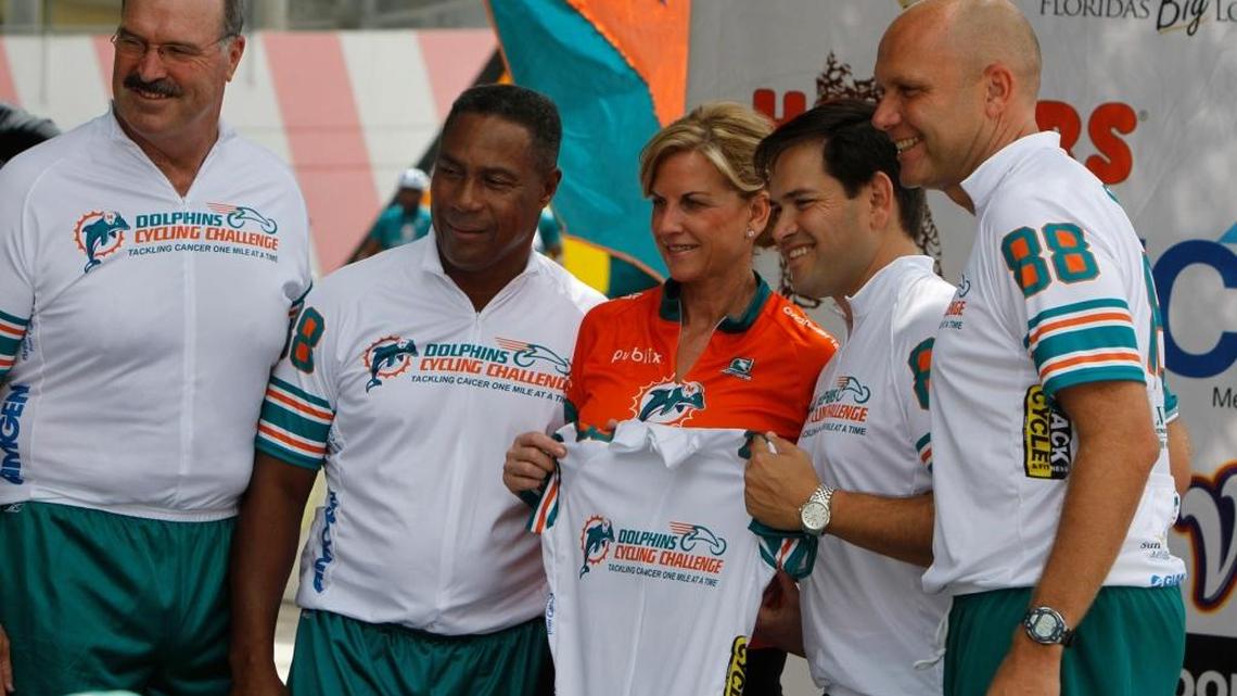 Bonnie Mandich, center, wife of Jim Mandich, a 2011 Ring of Honor Inductee, was recognized at a special ceremony to launch the Dolphins Cycling Challenge on Aug. 19, 2011, at Sun Life Stadium. Kim Bokamper, Nat Moore, Sen. Marco Rubio, and Mike Dee were at the presentation.