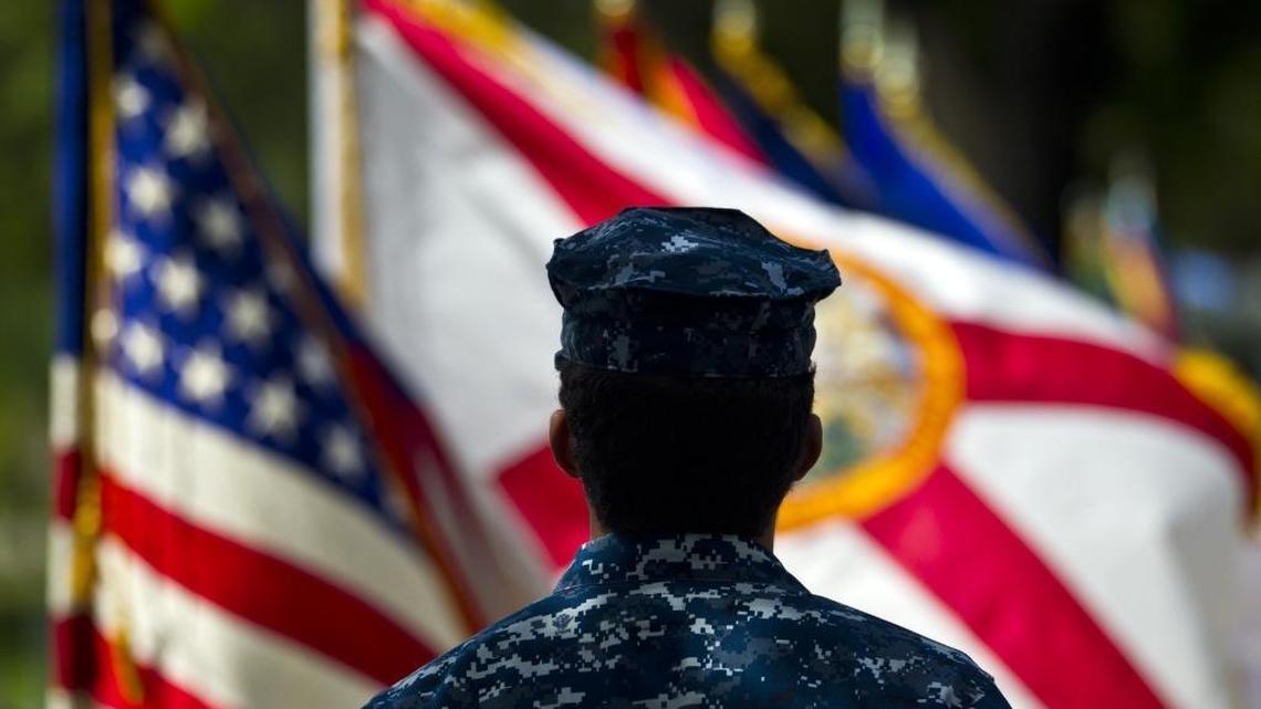 Members of the Military and Veterans attend a Special Memorial Day Service as The Greater Miami Chamber of Commerce's Military Affairs Committee honors veterans at a Memorial Day Remembrance Ceremony at Woodlawn Park Cemetery in Miami on Monday May 25, 2015.