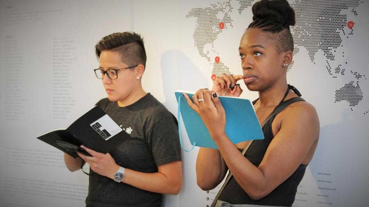Ammi Cabrera, left, and Deja Williams, right, sketch the inside of the MCAD building on a recent Saturday during SketchMIA.
