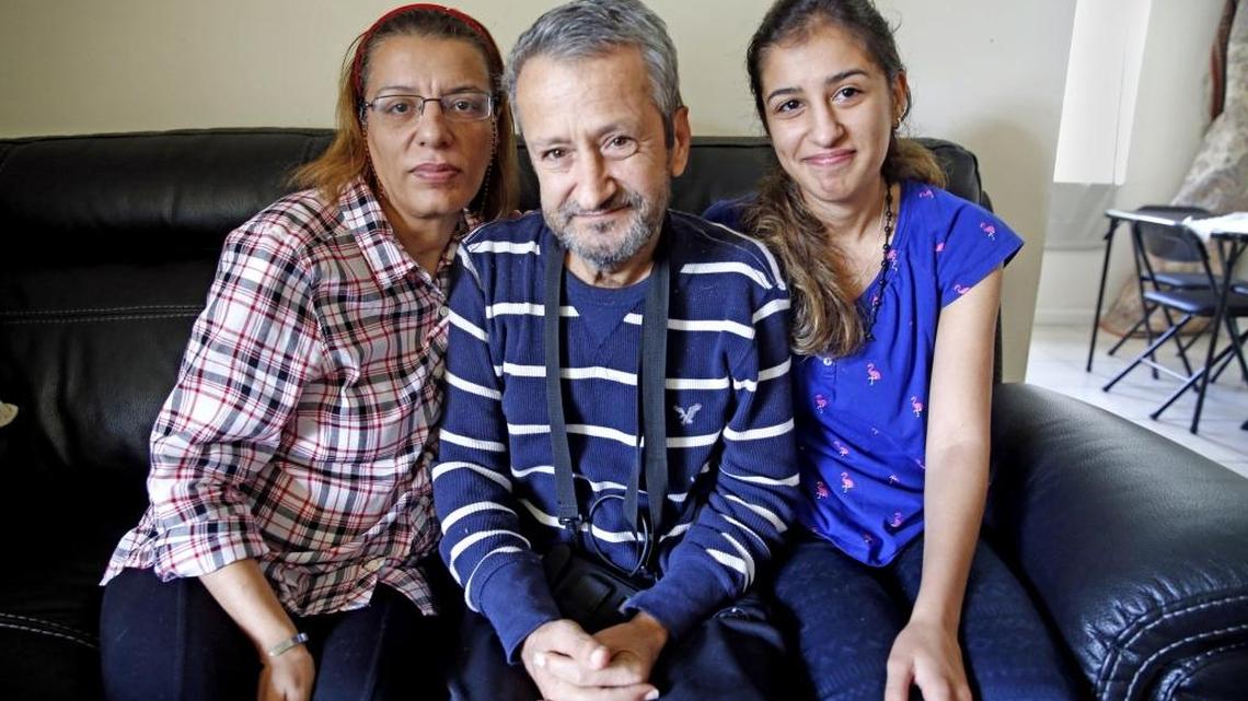 Syrian family Amal Jafar, Abdlhamit Saleh and Rama Saleh in their Fort Lauderdale apartment. The family arrived from Syria over the summer after escaping the war zone and moving to Turkey. They lived there for years before they were cleared to come to America. Once they got to Miami they learned that the mom’s breast cancer had spread. They have three children, 14, 17 and Rama 19. They are mourning the loss of their 27-year-old niece, who recently died after a boat capsized in the Mediterranean. They were trying to go to Greece.