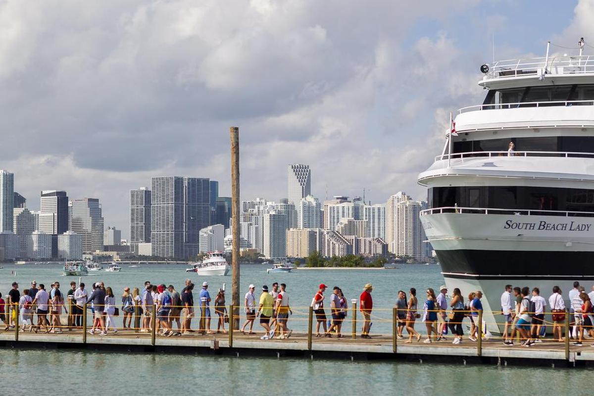 Attendees walk through the Miami International Boat Show at the Miami Marine Stadium in Virginia Key on Saturday, February 17, 2019.