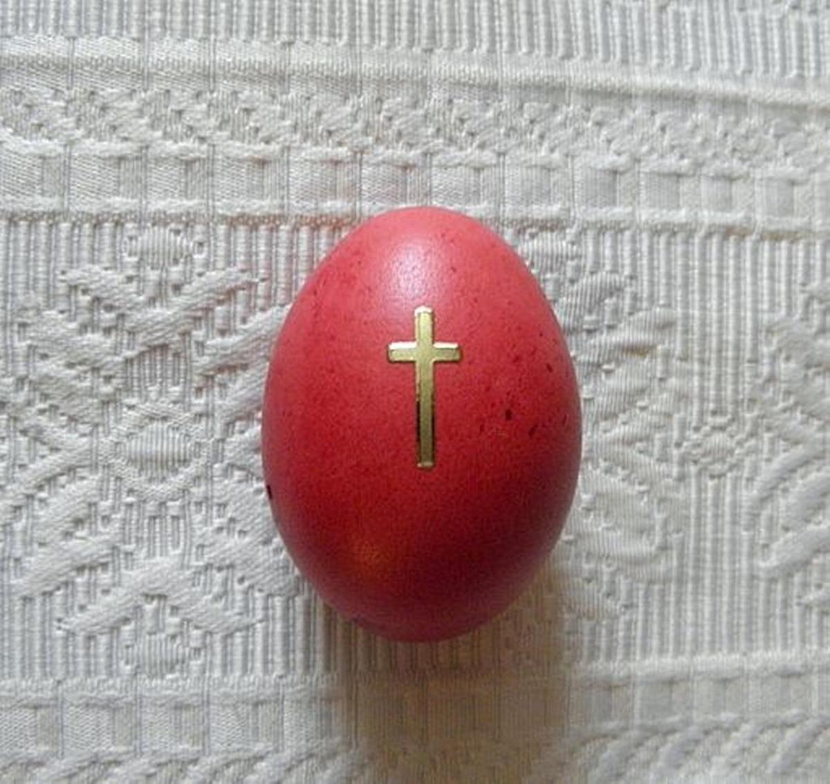 A red dyed Easter egg, also known as a Paschal egg, which typically symbolizes the blood of Jesus Christ.