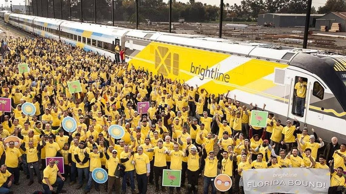 Siemens workers gather as the first completed Brightline train gets set to roll from the manufacturing facility in Sacramento, Calif., bound for South Florida.