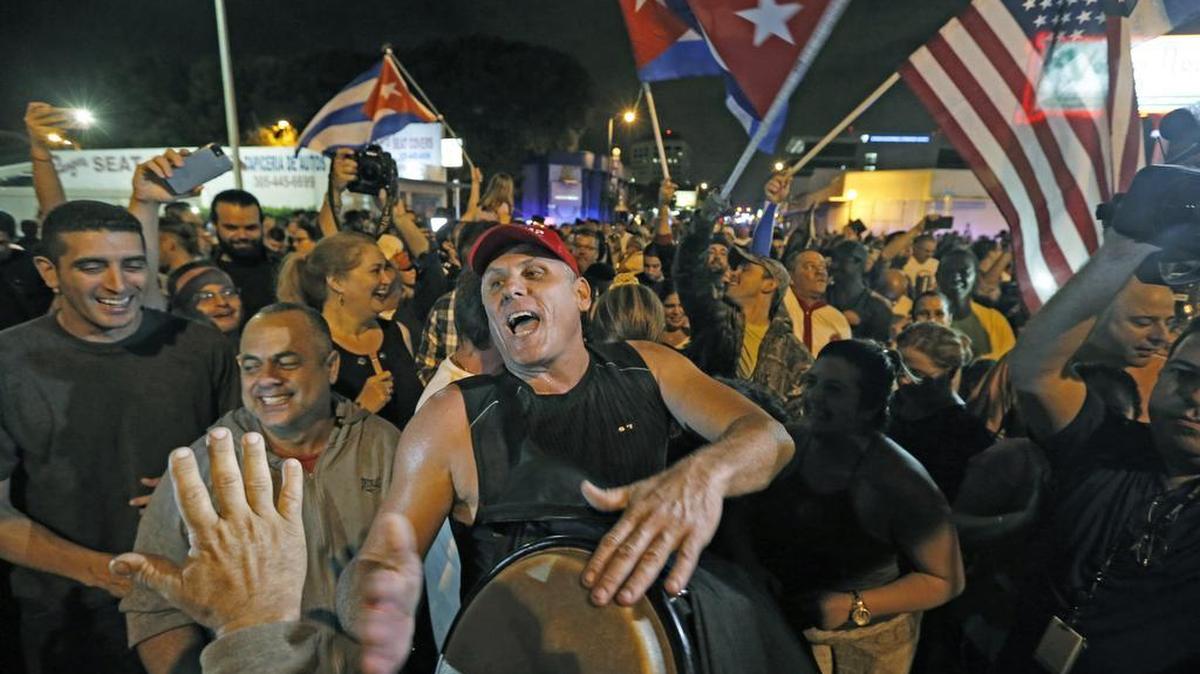 Miamians celebrate the death of former Cuban dictator Fidel Castro in front of Versailles Restaurant in Little Havana on Nov. 26, 2016.