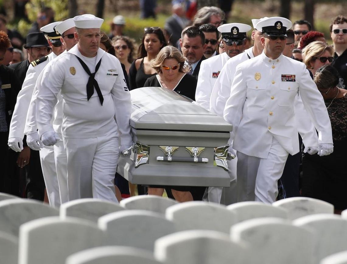 Naval Security Force Key West pallbearers carry the casket of Chris Hixon, who was the athletic director at Marjory Stoneman Douglas High School and was one of the 17 people killed on Feb. 14, 2018.