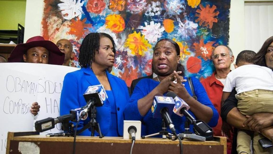 Fan Ayisyen nan Miyami (Haitian Women of Miami) Executive Director Marleine Bastien, left, stands next to Marie Carole Jeune, mother of a 21-year-old Haitian detainee at a news conference on Monday, Oct. 10.