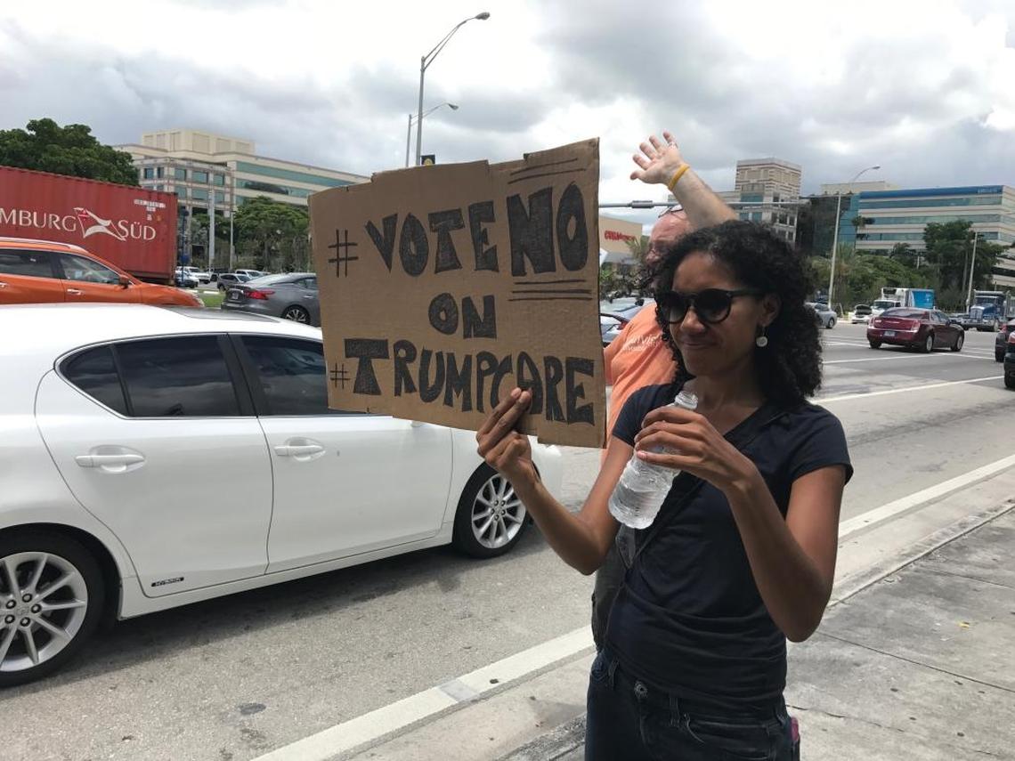 Linda Moren, 33, stood on the sidewalk on 36th Street in Doral near Sen. Marco Rubio’s office holding a sign that read ‘vote no on trumpcare’ on July 18, 2017. She was protesting for her mother, who was able to get cancer treatment under the Affordable Care Act.