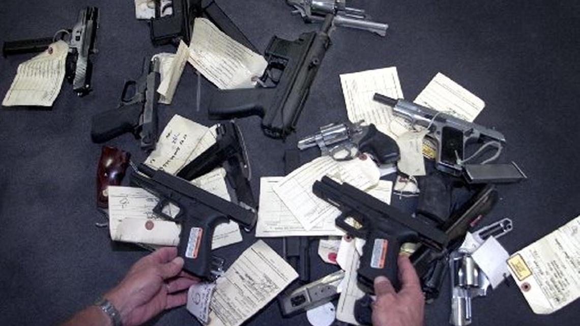 The 9mm Glock, held here by a federal agent after a gun seizure, is a popular handgun. A politically contentious legal fight, dubbed Docs vs. Glocks, over a Florida law that restricts doctors from discussing gun ownership with patients will be taken up by an entire federal appeals court after it threw out a prior decision upholding the statute as constitutional.