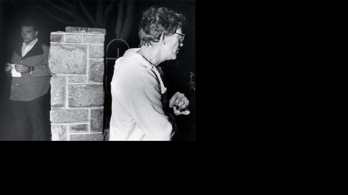 
FILE--Senator Gary Hart, right, walks away from Miami Herald reporter Jim McGee May 2, 1987, after talking with Herald reporters about the identity of a woman (Donna Rice) staying in his townhouse on Capitol Hill in Washington.
