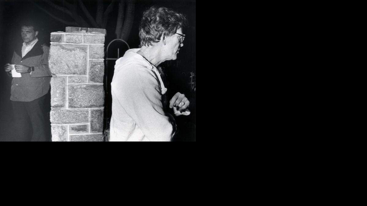 
FILE--Senator Gary Hart, right, walks away from Miami Herald reporter Jim McGee May 2, 1987, after talking with Herald reporters about the identity of a woman (Donna Rice) staying in his townhouse on Capitol Hill in Washington.
