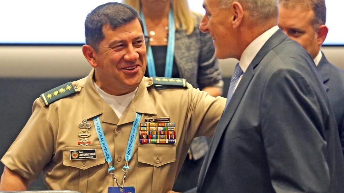 Colombian General Juan P. Rodriguez Barragan greets U.S. Secretary of Homeland Security John Kelly before the opening ceremony of the Conference on Prosperity and Security in Central America as at the U.S. Southern Command in Doral, FL, June 16, 2017.