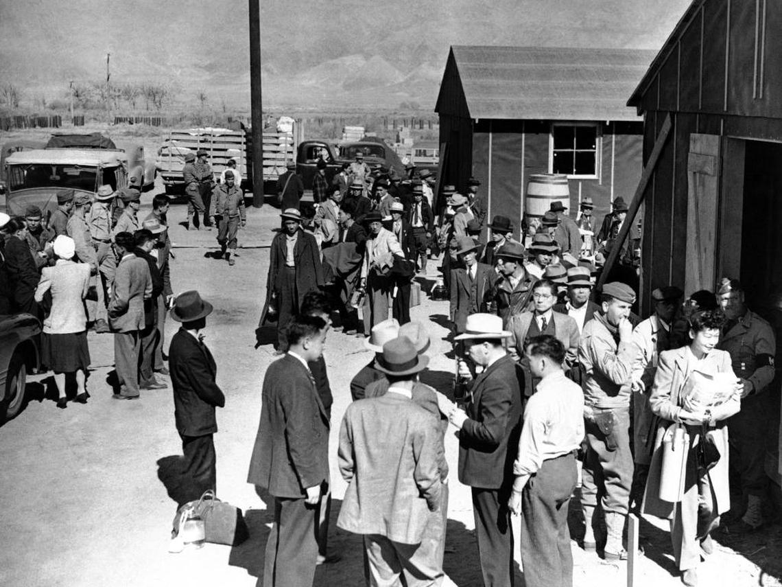This March 23, 1942, file photo shows the first arrivals at the Japanese evacuee community established in Owens Valley in Manzanar, Calif., part of a vanguard of workers from Los Angeles. Roughly 120,000 Japanese immigrants and Japanese-Americans were sent to camps that dotted the West because the government claimed they might plot against the U.S.