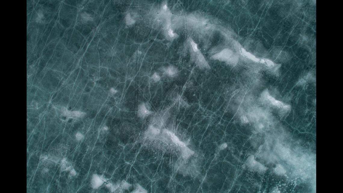 Search and rescue crews are looking for a woman who broke through the ice at Big Island Pond, near Atkinson, New Hampshire, officials say.