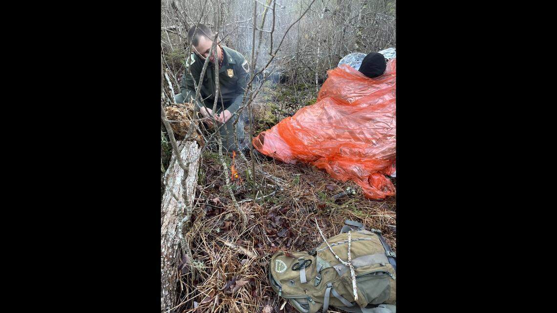 Rescuers lit a fire and gave lost hikers food and warm drinks after finding them in the middle of a bog Dec. 31 in Steep Falls, Maine, wildlife officials said.
