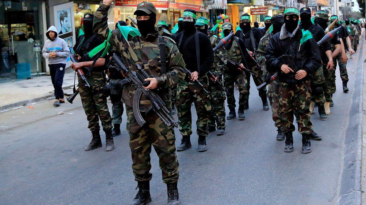 Members of the military wing of Hamas pictured in 2015. The group is considered a terrorist organization by the U.S. government. (AP Photo/Adel Hana, File)