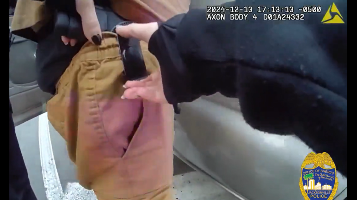 Body-worn camera footage shows the moment a Florida police officer shot a driver during a traffic stop while trying to remove his gun.