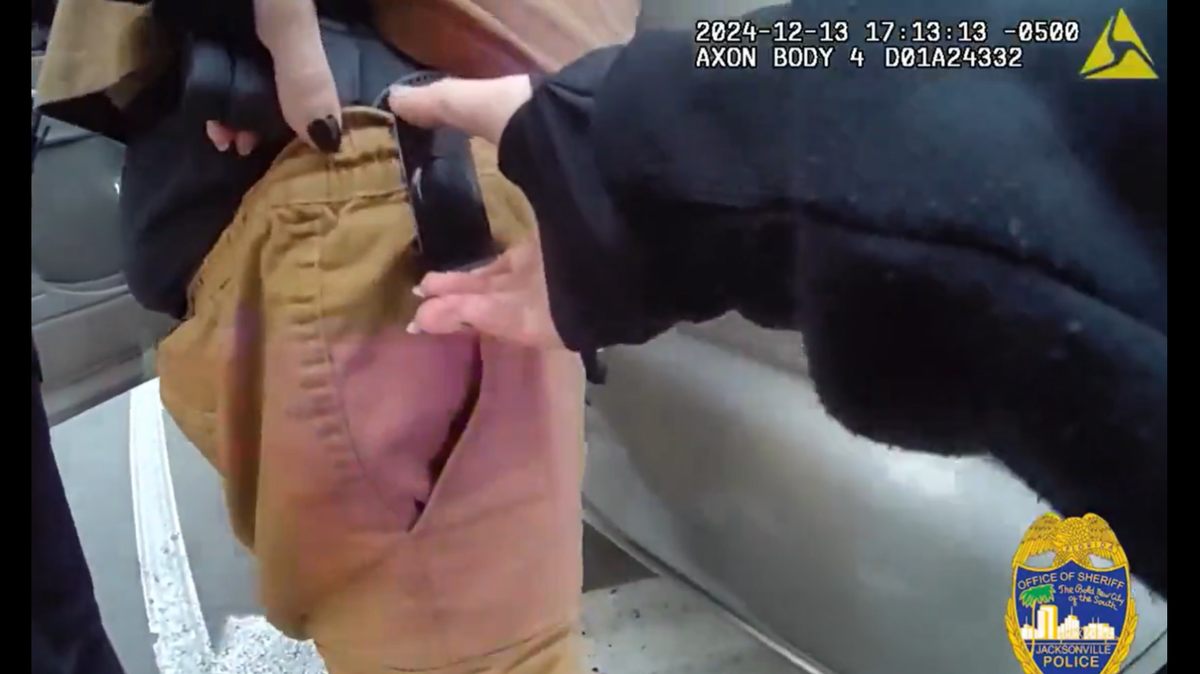 Body-worn camera footage shows the moment a Florida police officer shot a driver during a traffic stop while trying to remove his gun.