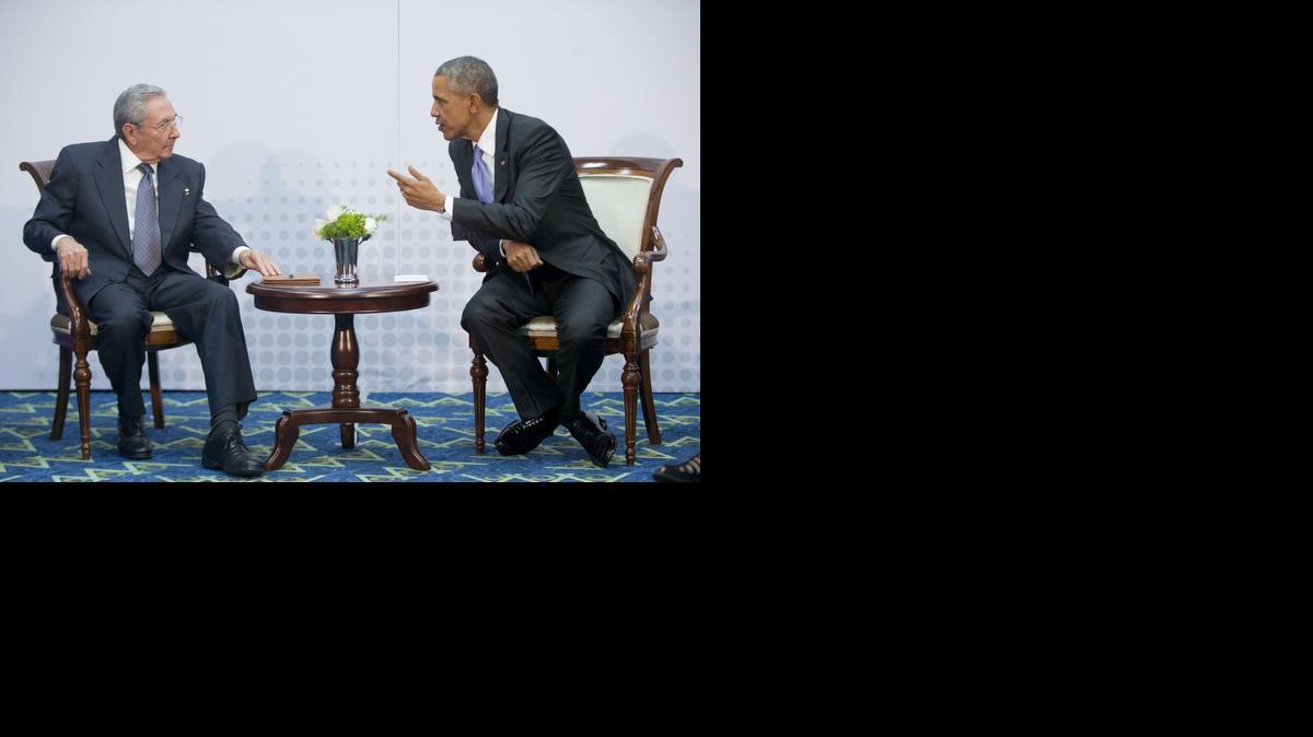 
U.S. President Barack Obama, right, leans over toward Cuban leader Raul Castro during their meeting at the Summit of the Americas in Panama City, Panama, Saturday, April 11, 2015. The leaders of the United States and Cuba held their first formal meeting in more than half a century on Saturday, clearing the way for a normalization of relations that had seemed unthinkable to both Cubans and Americans for generations.
