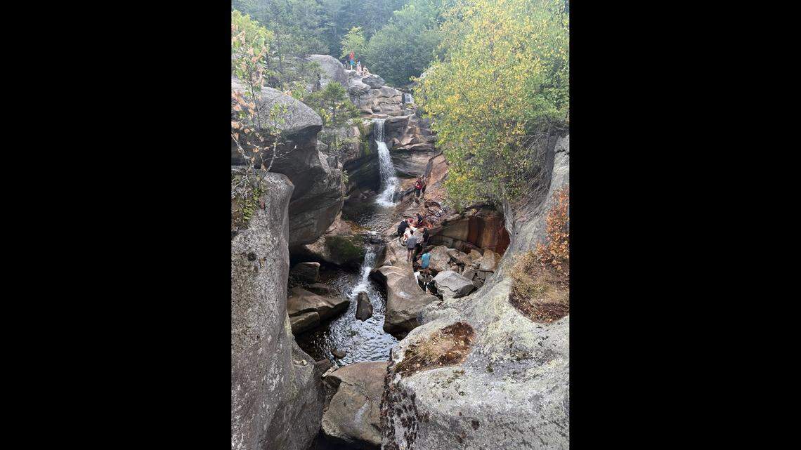 A 21-year-old was airlifted to a hospital after falling from a ledge at a waterfall.
