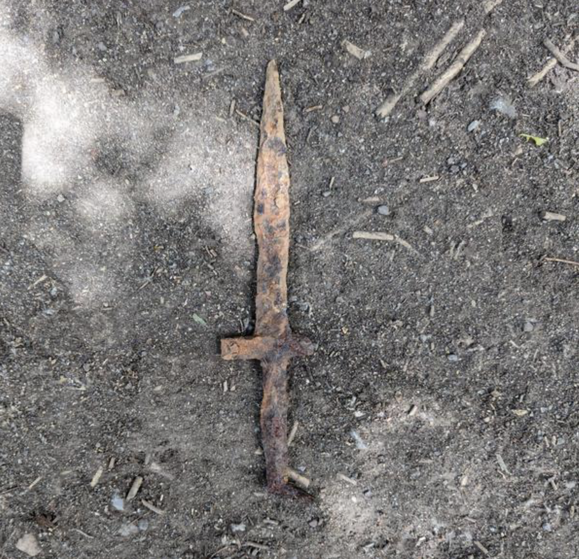 The dagger was found alongside ancient burial mounds, officials said.