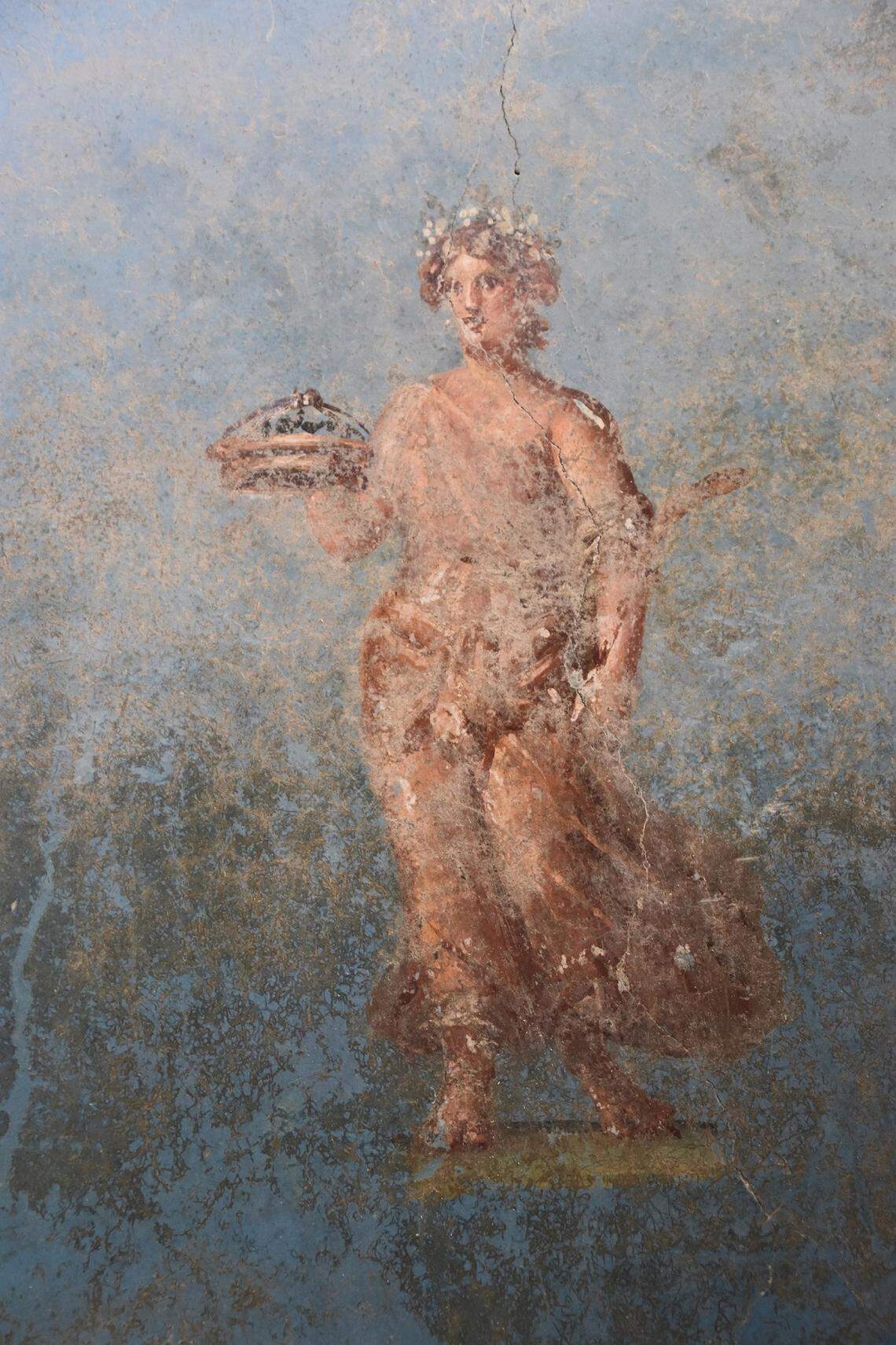 A female figure painted on one of the shrine walls