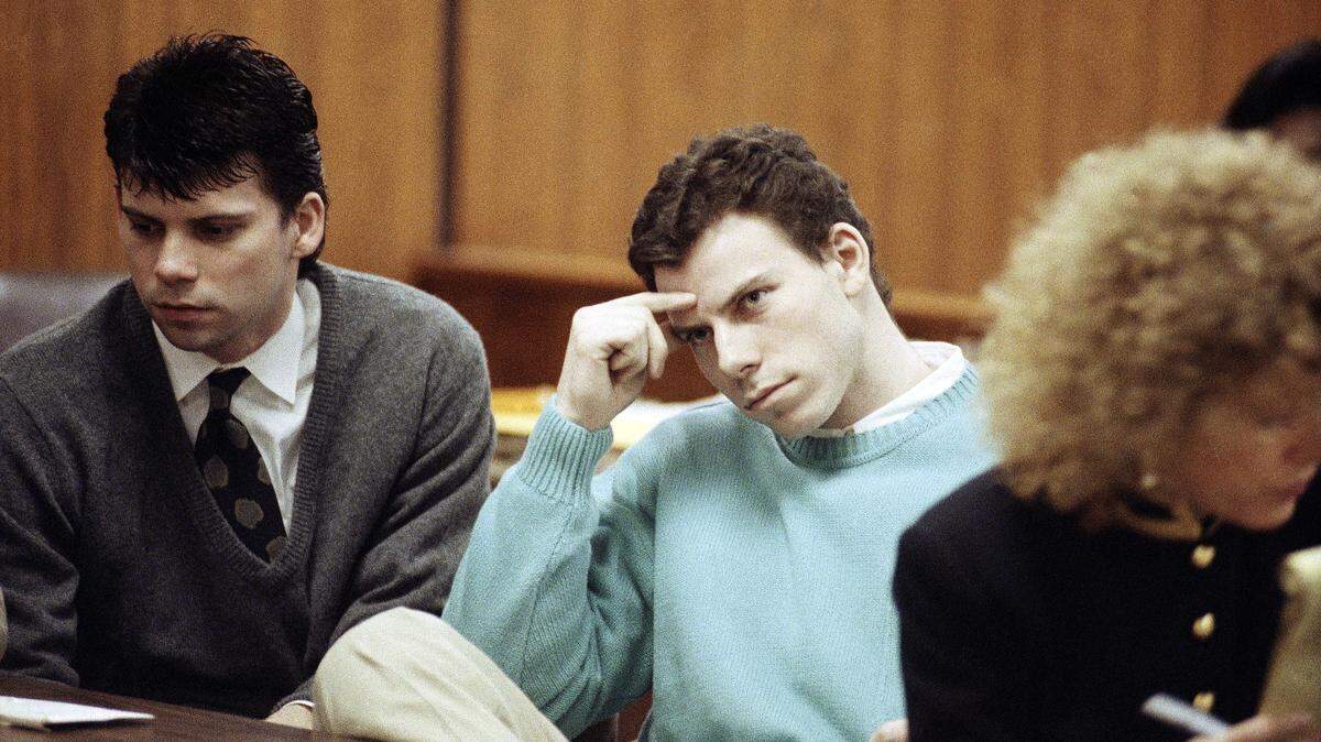 Lyle Menendez, left, and his brother, Erik, sit at the defense table during a hearing in a Beverly Hills, Calif., courtroom, April 3, 1991. The brothers, who are suspected in the death of their parents, won another delay while they seek a state Supreme Court opinion on whether an alleged murder confession if protected by doctor-patient privilege. (AP Photo/Kevork Djansezian)