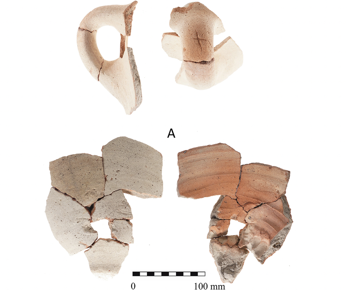 The handle and lower portion of a Canaanite jar found at the site