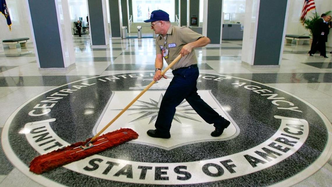 In this March 3, 2005 file photo, a workman slides a dustmop over the floor at the Central Intelligence Agency headquarters in Langley, Va.