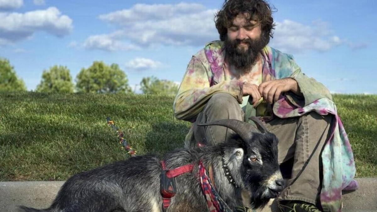 Erick Brown during a 2015 road trip with his goat, Deer, through Kansas City. Brown and his horned goat “service animal” were heckled and forced to get off a Detroit bus Sunday night, video shows.