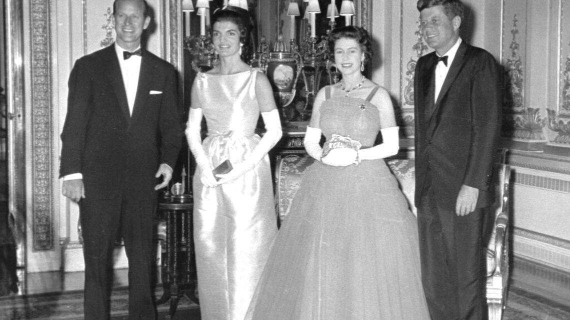 Britain’s Queen Elizabeth II poses with U.S. President John F. Kennedy before a state dinner at Buckingham Palace on June 5, 1961. Also seen are Prince Philip, left, and President Kennedy’s wife, Jackie, second from left.