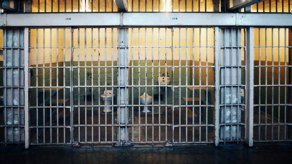 A former corrections officer is charged with misdemeanors after officials say he sexually assaulted two co-workers.