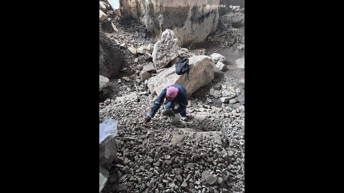 The remains of a 2,500-year-old baby, who may have been buried alive, were discovered in a cave in Mexico, officials said.