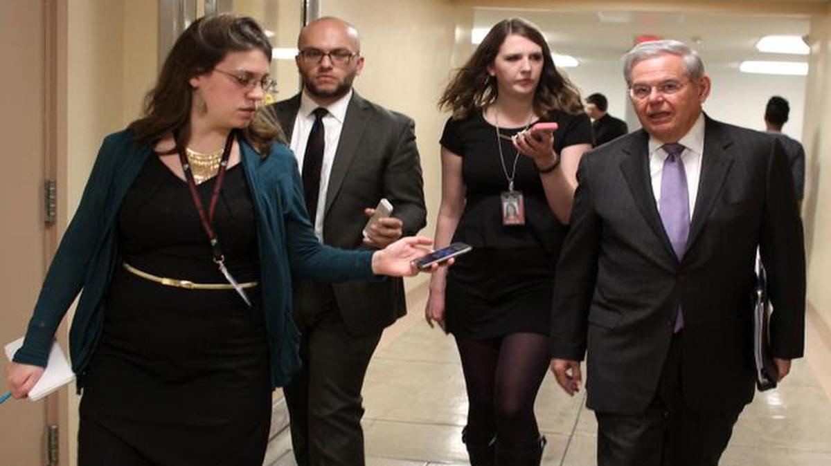 
Sen. Bob Menendez, D-N.J., right, is pursued by reporters on Capitol Hill in Washington, Wednesday, Feb. 25, 2015, as Democrats and Republicans headed to their party caucus meetings to discuss the homeland security funding. House Republicans reacted tepidly at best Wednesday to calls from the upper reaches of both political parties for legislation funding the Department of Homeland Security without immigration-related provisions opposed by the White House. 
