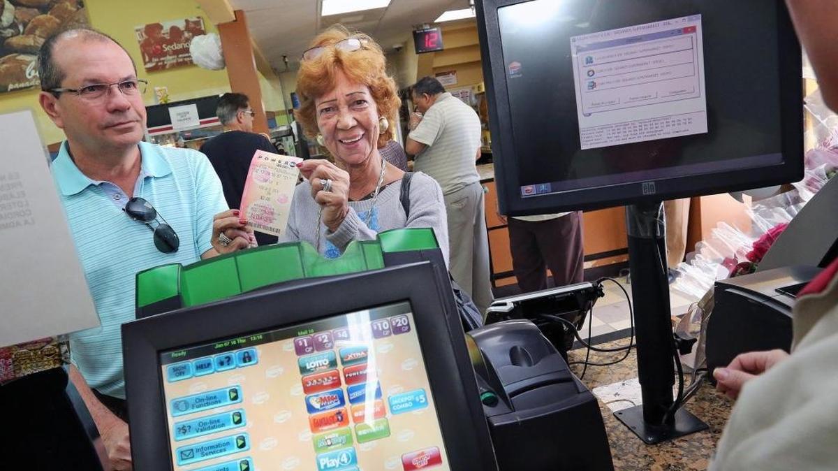Vilma Gutierrez and Luis Rodriguez buy Powerball tickets at Sedano's Supermarket on Coral Way and 122nd Avenue. The Powerball jackpot is at $440 million as of Tuesday, Jan. 2, 2018, and the Mega Millions jackpot is at $418 million.
